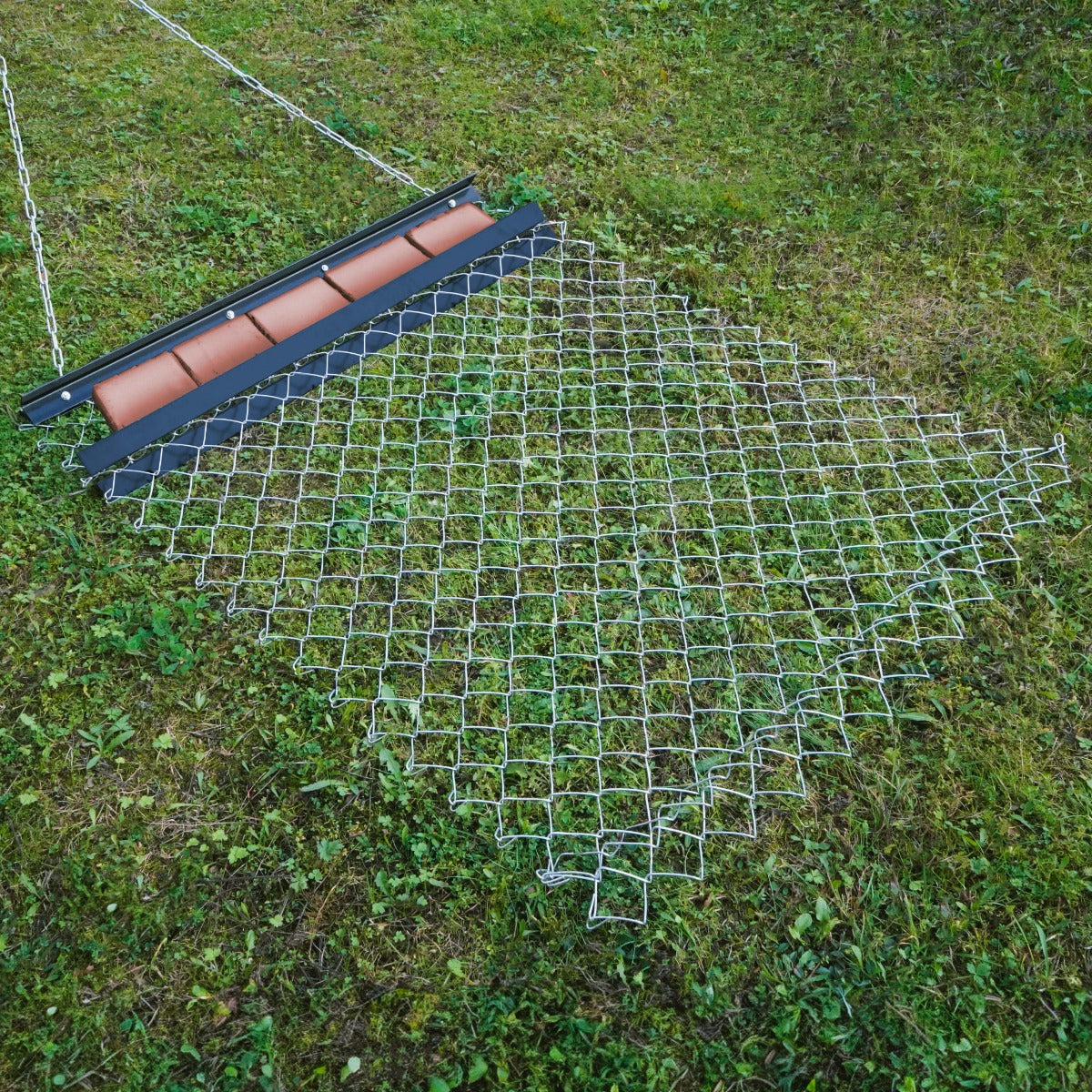 Durable chain drag harrow measuring 1.5m x 1.2m, featuring a metal grid design with a sturdy frame, ideal for soil leveling and landscaping