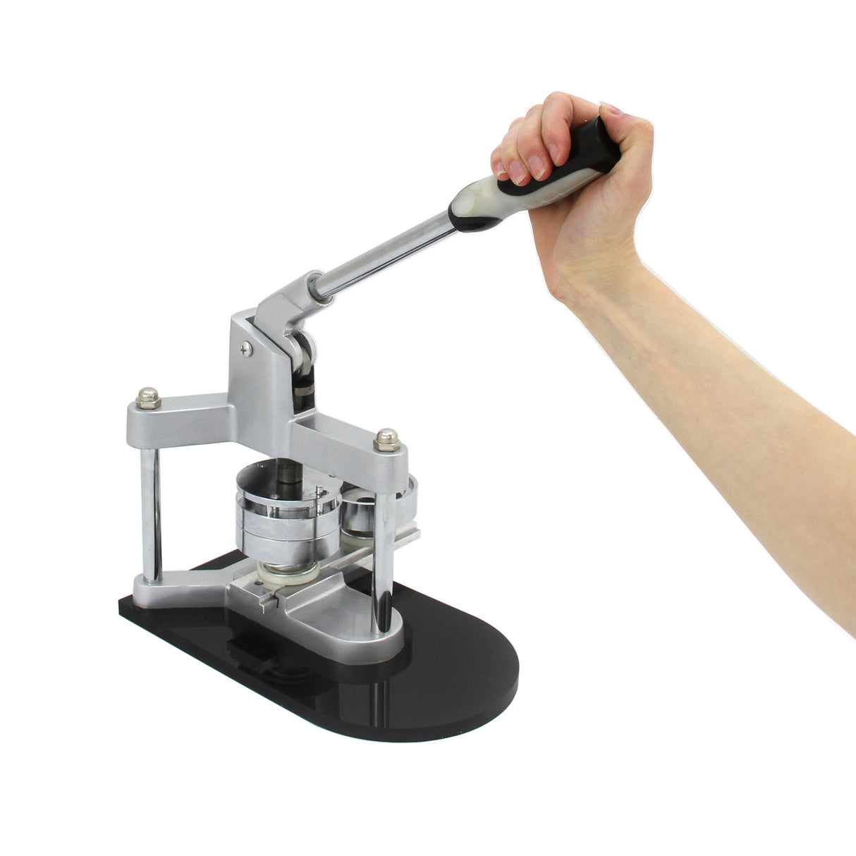 Metal badge press with a sleek black base, featuring a hand-operated lever and circular cutter for creating custom badges