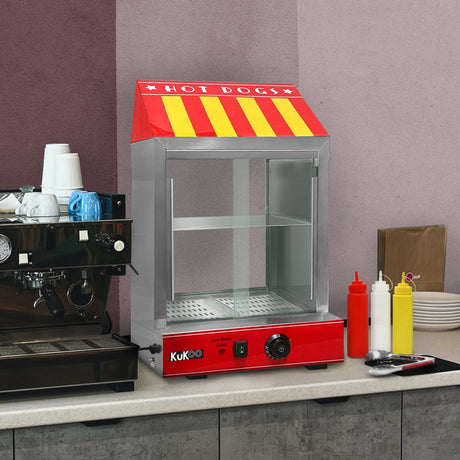 Bright red hot dog warmer with a striped roof, glass front, and stainless steel accents, set against a modern kitchen backdrop