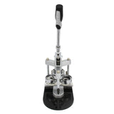 Heavy-duty badge maker with a sleek silver handle, sturdy black base, and circular molds for creating custom badges