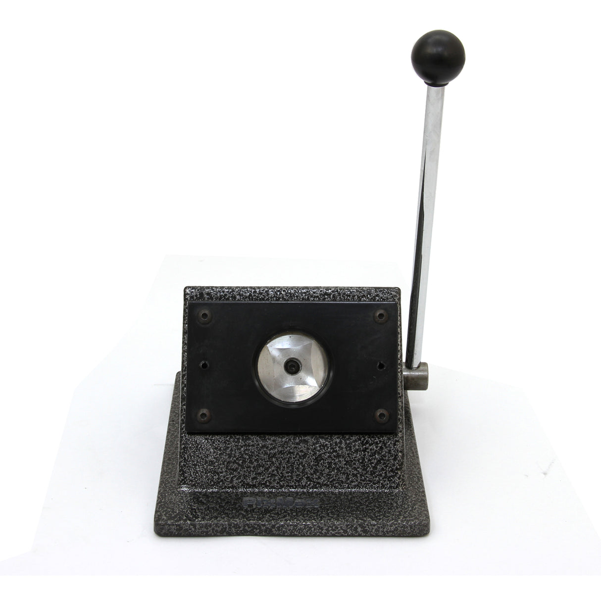 Heavy-duty badge maker with a textured black base, silver lever, and circular cutting area for creating custom badges